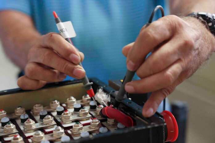 Theodore Cochran, 9th Maintenance Squadron lead battery technician, checks the voltage of the emergency battery used on the U-2 Dragon Lady, and the T-38 Talon, with a fluke multimeter Aug. 11, 2023, at Beale Air Force Base, California.