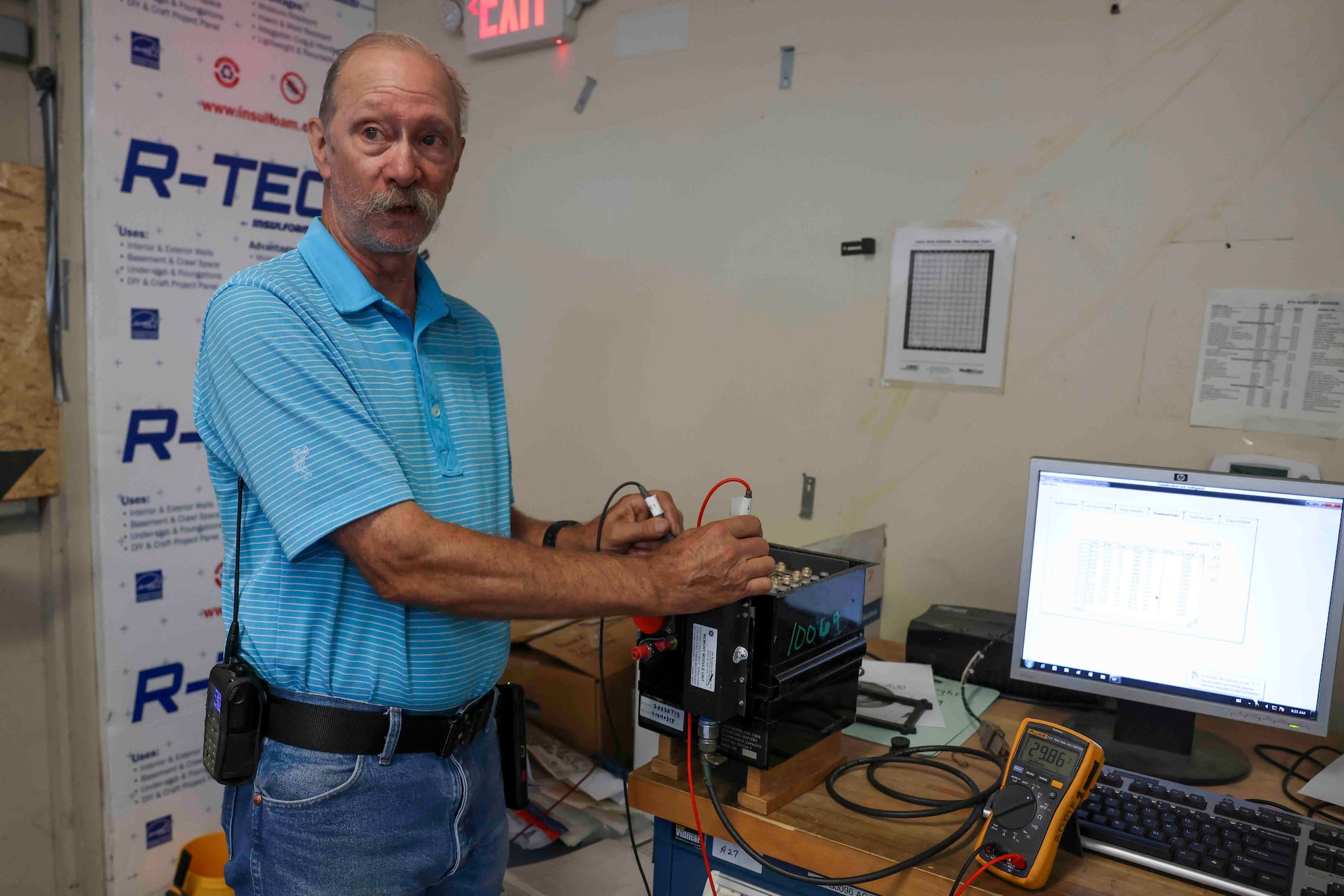 Theodore Cochran, 9th Maintenance Squadron lead battery technician, explains the importance of checking the voltage of the battery used on the U-2 Dragon Lady, and the T-38 Talon, with a fluke multimeter, Aug. 11, 2023 at Beale Air Force Base, California.