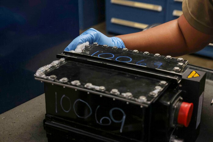 U.S. Air Force Staff Sgt. Mary Daria, 9th Maintenance Squadron electrical and environmental systems craftsmen, performs a leak test on a battery case lid Aug. 11, 2023 at Beale Air Force Base, California.
