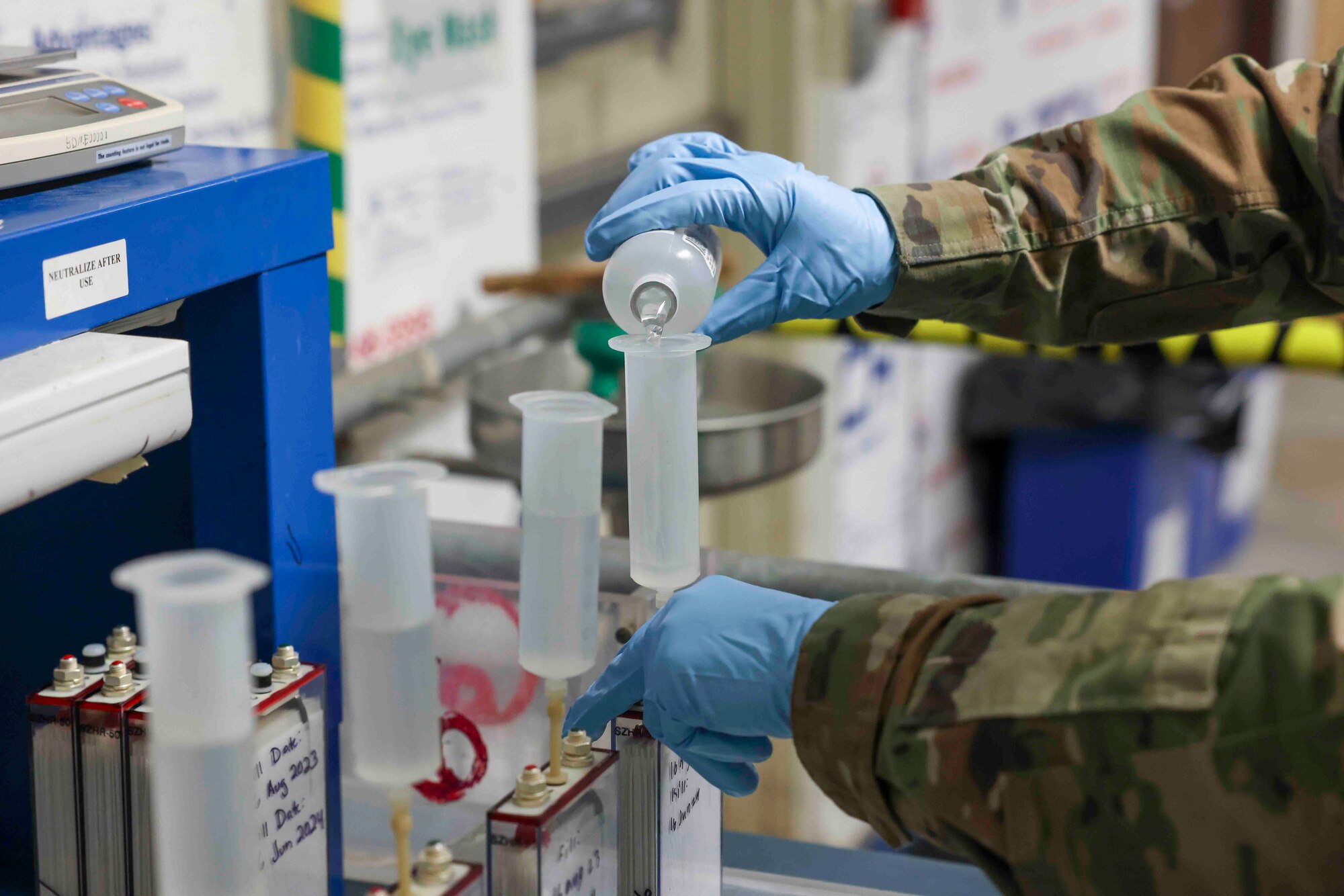 U.S. Air Force Senior Airman Maxwell Karline, 9th Maintenance Squadron electrical and environmental systems craftsmen, adds electrolyte solution to a battery cell using a narrow syringe prior to its initial charge, Aug. 16, 2023, at Beale Air Force Base, California.