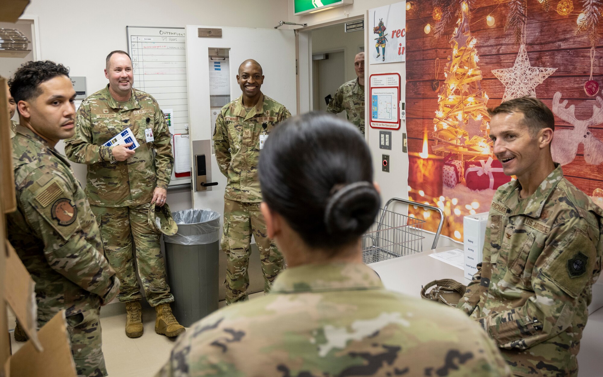 Members of the 35th Medical Group’s TRICARE Operations and Patient Administration Flight discuss the transfer of medical documents from physical copies to a digital format with Col. Michael Richard, 35th Fighter Wing commander, during a Wild Weasel Walk-through at Misawa Air Base, Japan.