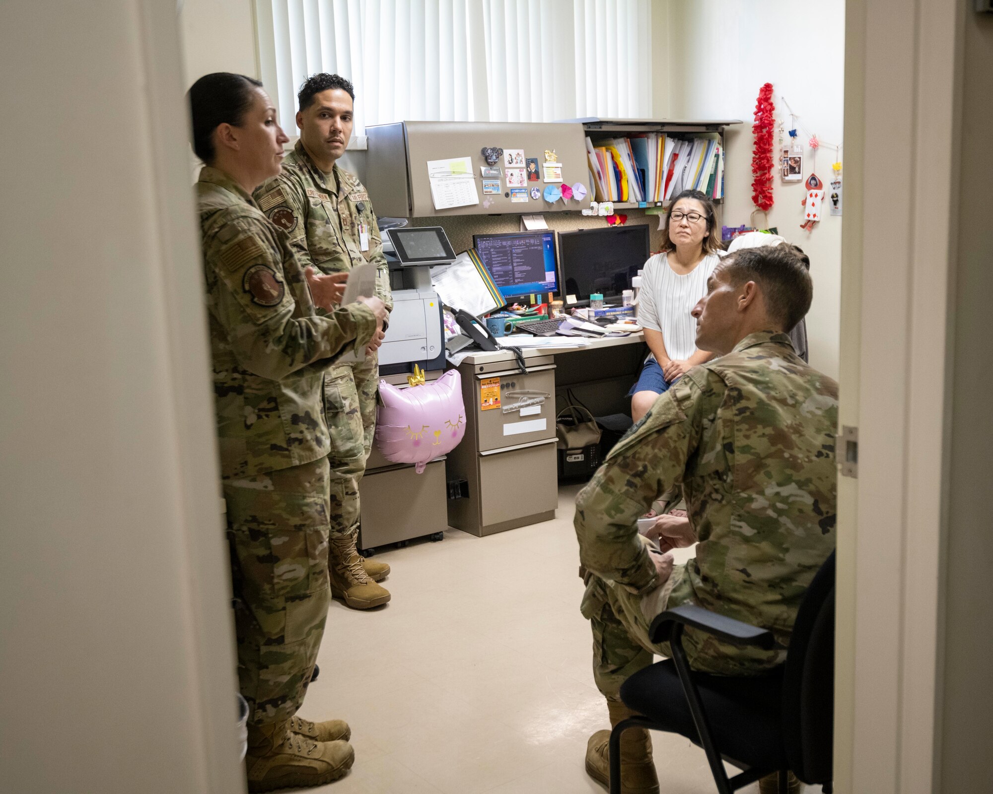 Members of the 35th Medical Group’s TRICARE Operations and Patient Administration Flight discuss the upcoming changes with Col. Michael Richard, 35th Fighter Wing commander, during a Wild Weasel Walk-through at Misawa Air Base, Japan.