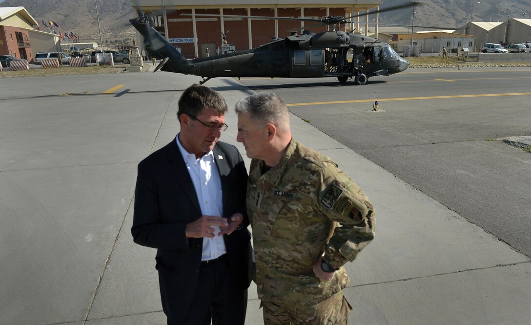 Then-Deputy Defense Secretary Ashton Carter talks with then-Lt. Gen. Mark Milley in Kabul, Afghanistan, on Sept. 16, 2013