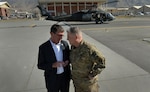 Then-Deputy Defense Secretary Ashton Carter talks with then-Lt. Gen. Mark Milley in Kabul, Afghanistan, on Sept. 16, 2013