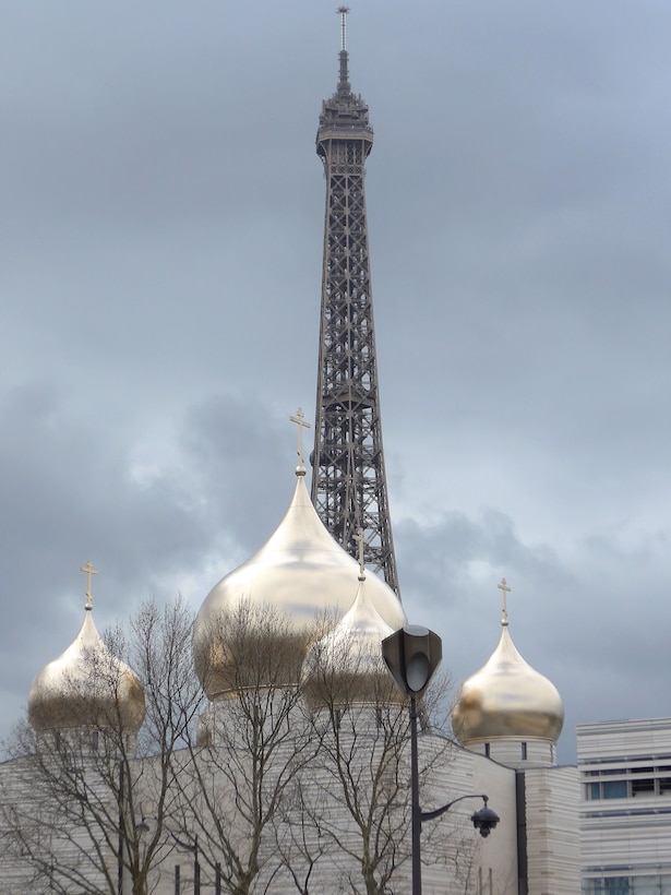 Eiffel Tower with Holy Trinity Cathedral: Russian Orthodox Church in the foreground. Paris, France, March 12, 2018