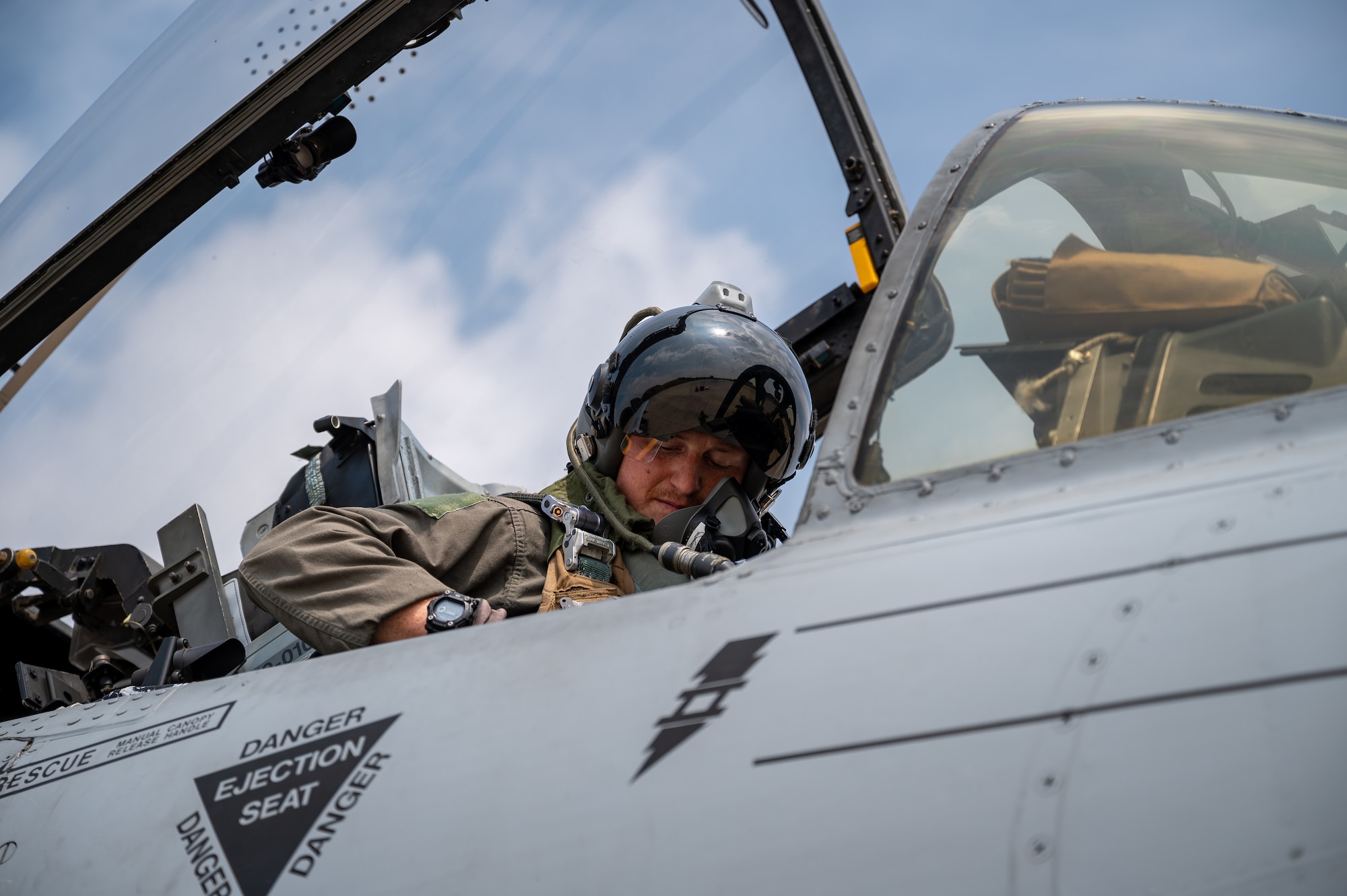 U.S. Air Force Capt. Jacob Stafford, 25th Fighter Squadron pilot, buckles in prior to takeoff at Osan Air Base, Republic of Korea, Aug. 31, 2023. The 25th FS conducts multiple aerial training missions per day to enhance their skills and bolster a defensive posture within the Indo-Pacific region. (U.S. Air Force photo by Staff Sgt. Thomas Sjoberg)