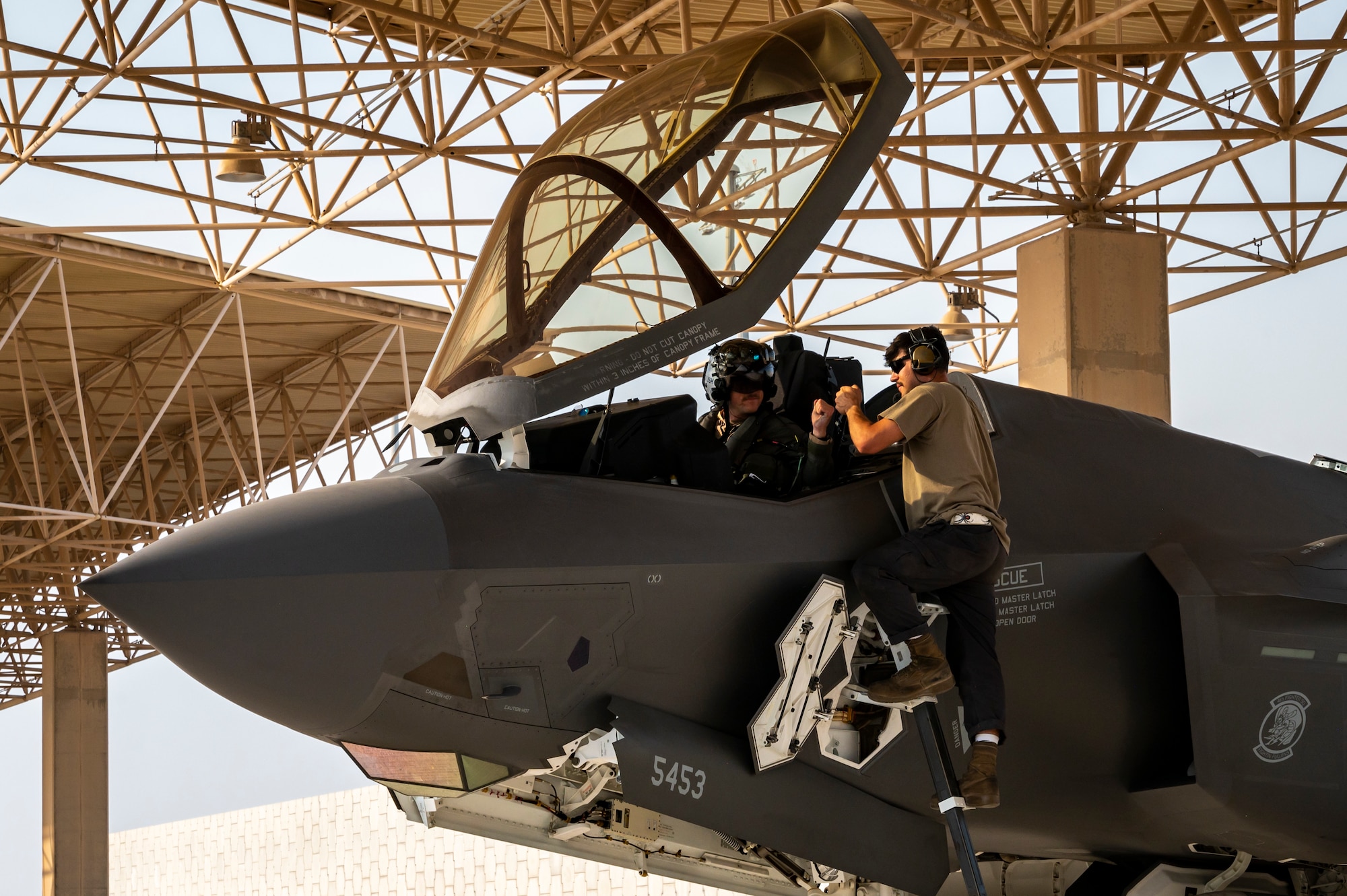 People talking next to an aircraft