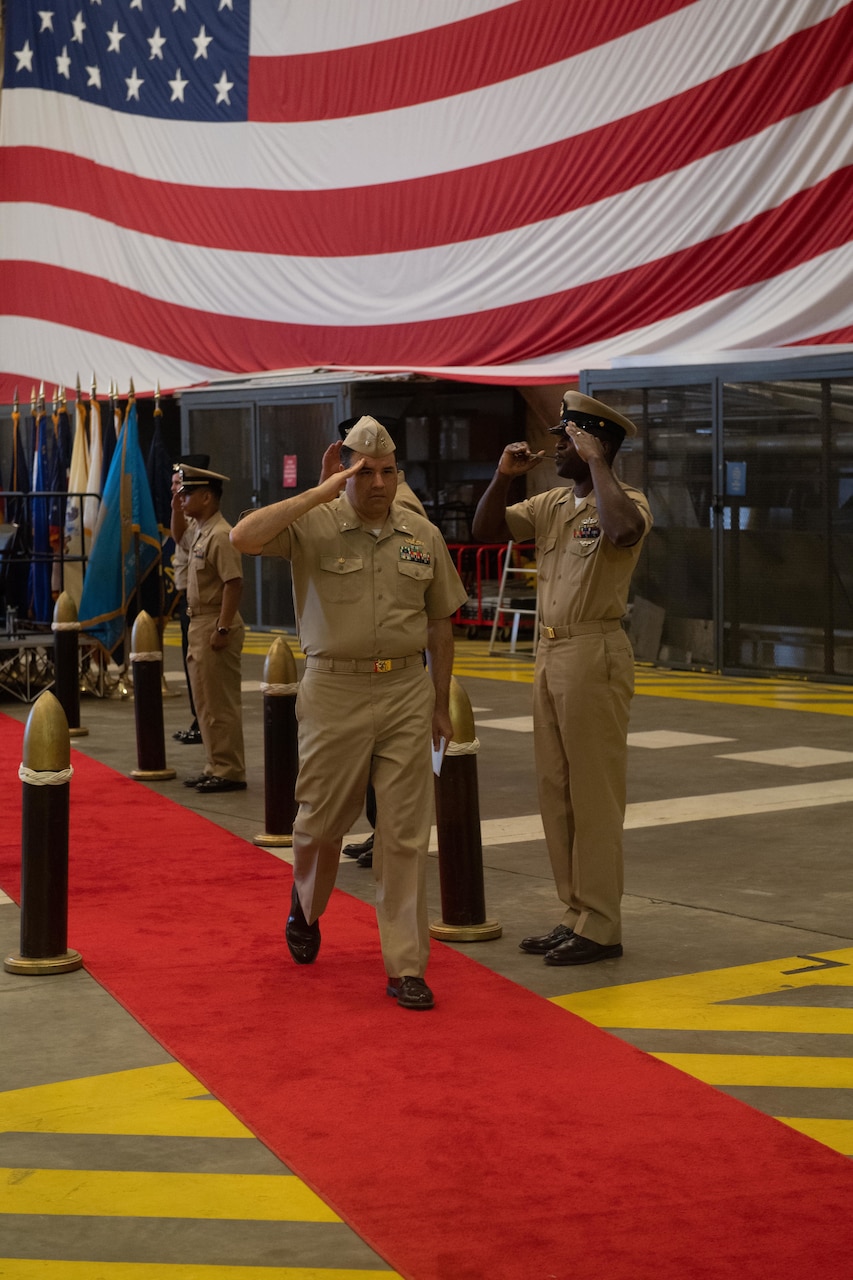 230906-N-DH811-1091 Virginia Beach, Va. (Sept. 6, 2023)— Cmdr. Brian Lucas, a Reserve surface warfare officer, departs his assumption of command ceremony, Sept. 6, onboard Joint Expeditionary Base Little Creek-Fort Story. Navy Expeditionary Combat Command’s Maritime Expeditionary Security Force deploys globally and operates throughout the sea-to-shore and inland operating environment, protecting maritime infrastructure, providing insertion and extraction capabilities and supporting assets enabling maritime operations. (U.S. Navy photo by Mass Communication Specialist 1st Class Benjamin T. Liston)