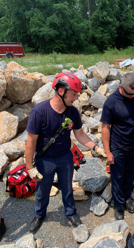 Photo is of a firefighter man conducting training.