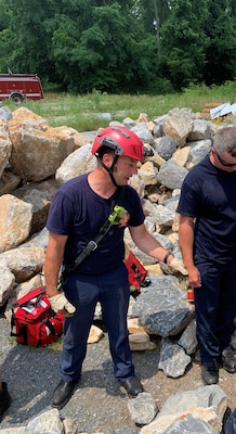 Photo is of a firefighter man conducting training.