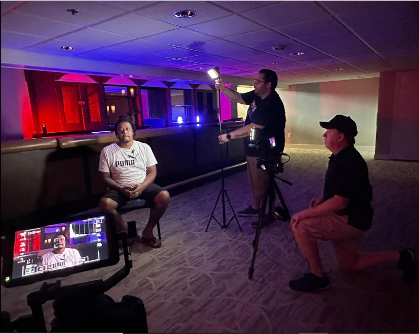 The Twisted Paranormal Society film crew readies DLA Aviation's, Herman Wilson, for an interview at the Bellwood Manor House, at Defense Supply Center, Richmond Virginia,