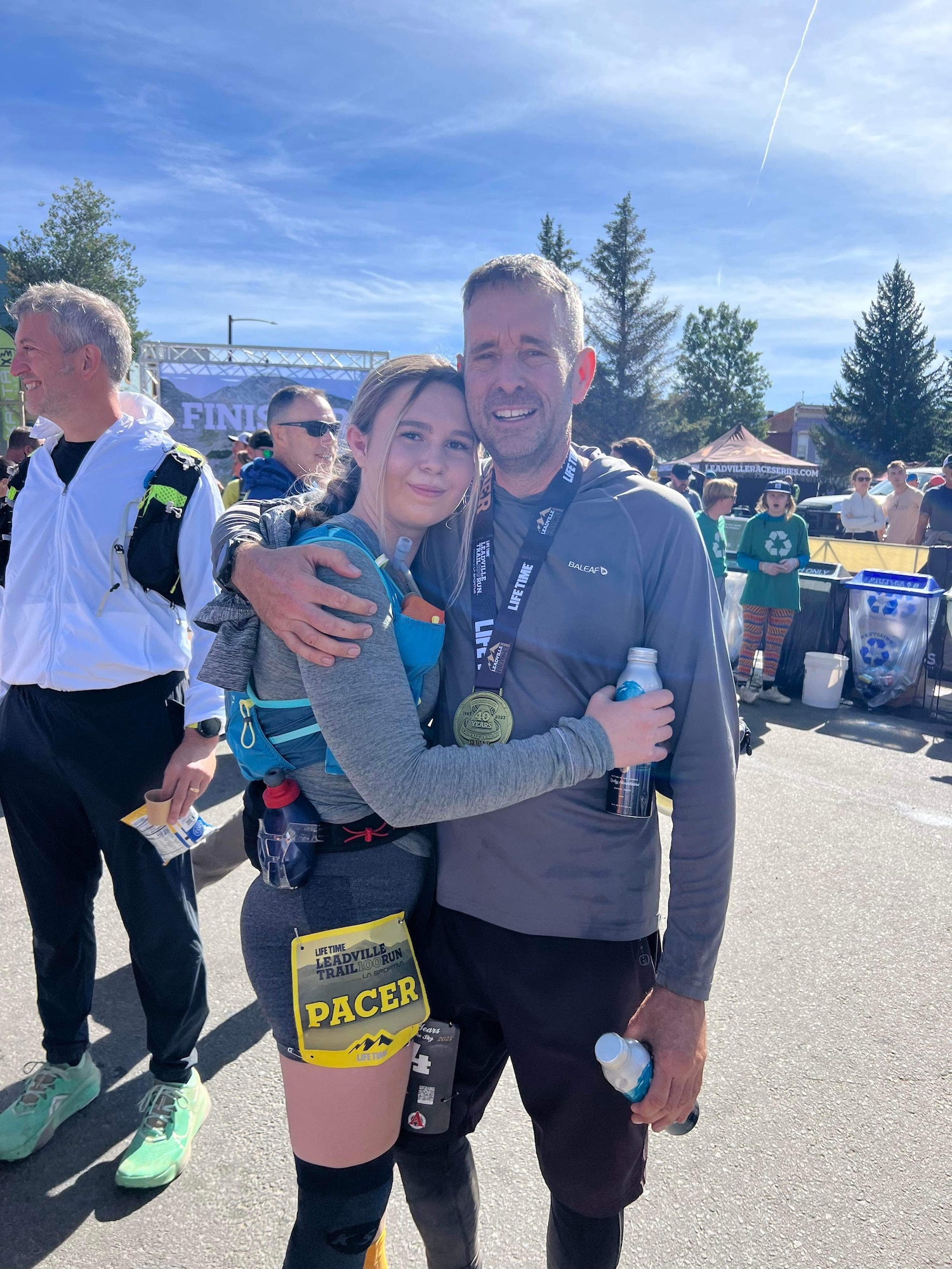 Patrick Buzzard, 4th Test and Evaluation Squadron security manager, right, and his daughter, Hailey Buzzard, left, pose for a photo after crossing the finish line of the Leadville Trail 100 Run near Leadville, Colorado, Aug. 20, 2023. Hailey paced her father for the final 12.4 miles of the race. The Leadville Trail 100 Run is an ultramarathon held annually on rugged trails and dirt roads through the heart of the Rocky Mountains. The course is a 50-mile out-and-back dogleg run primarily on the Colorado Trail, starting at 10,200 feet. The centerpiece of the course is the climb up to Hope Pass at 12,620 feet, encountered on both the outbound trek and on the return. Buzzard finished the 100-mile course in 29 hours, 48 minutes, and 57 seconds, just beating the 30-hour time limit. (Courtesy photo)