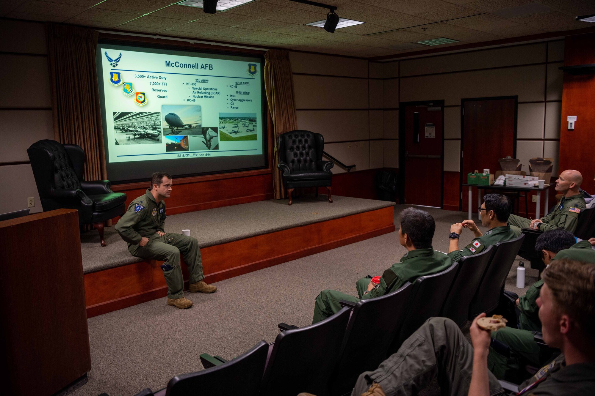 Lt. Col. Adam Gray,344th Air Refueling Squadron commander, discusses KC-46A Pegasus with members from the Japan Air Self-Defense (JASDF) Aug. 29, 2023, at McConnell Air Force Base, Kansas. McConnell Airmen informed the JSDAF members from the 405th Air Refueling Squadron how to effectively operate the KC-46 during their three-day tour of the base. (U.S. Air Force photo by Airman 1st Class William Lunn)