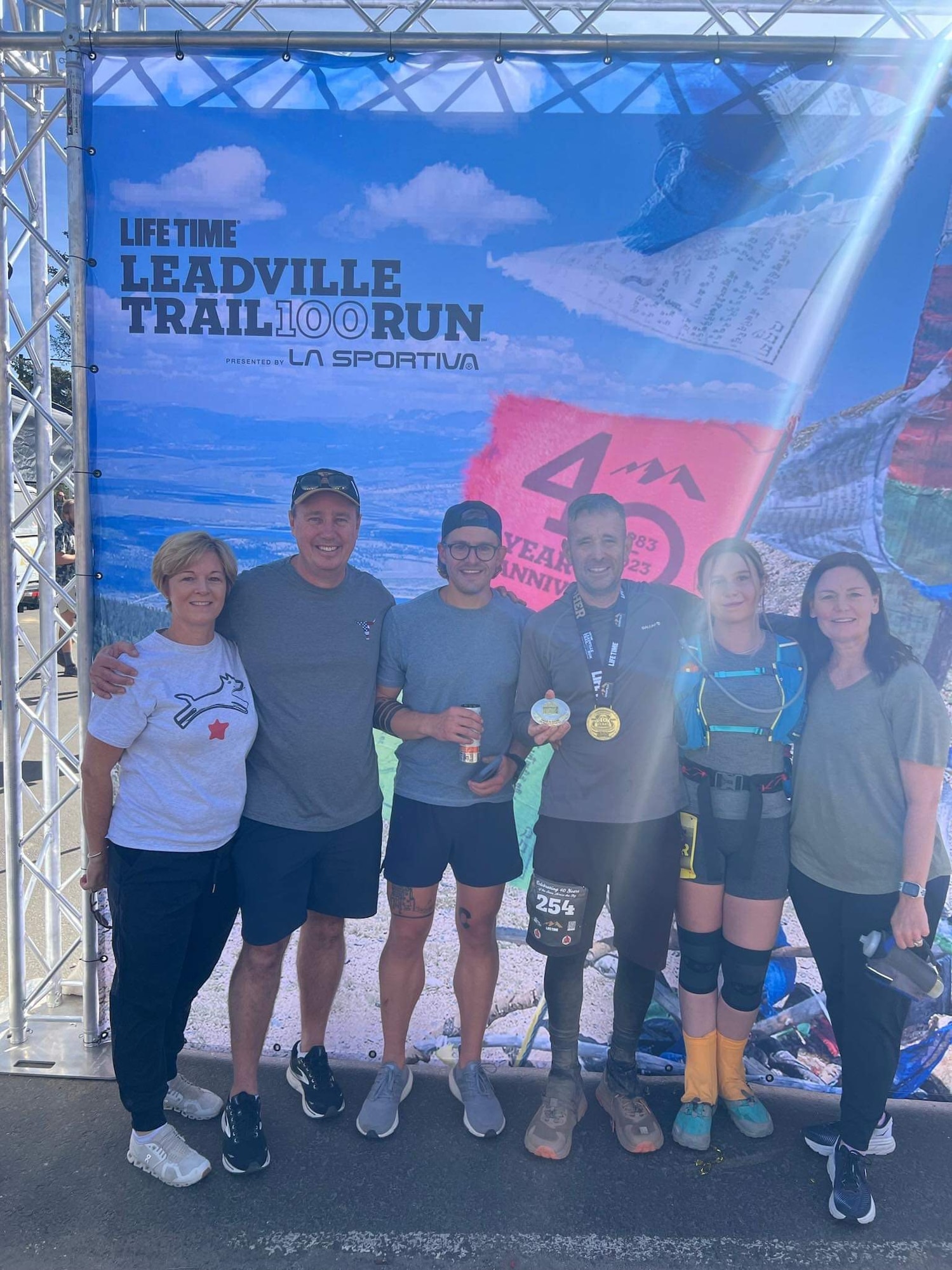 (From left to right) Kristen Barker, Matt Barker, Benjamin Shearer, Patrick Buzzard, Hailey Buzzard, and Christine Buzzard, pose for a group photo after Patrick completed the Leadville Trail 100 Run near Leadville, Colorado, Aug. 20, 2023. The Leadville Trail 100 Run is an ultramarathon held annually on rugged trails and dirt roads through the heart of the Rocky Mountains. The course is a 50-mile out-and-back dogleg run primarily on the Colorado Trail, starting at 10,200 feet. The centerpiece of the course is the climb up to Hope Pass at 12,620 feet, encountered on both the outbound trek and on the return. Buzzard finished the 100-mile course in 29 hours, 48 minutes, and 57 seconds, just beating the 30-hour time limit. (Courtesy photo)