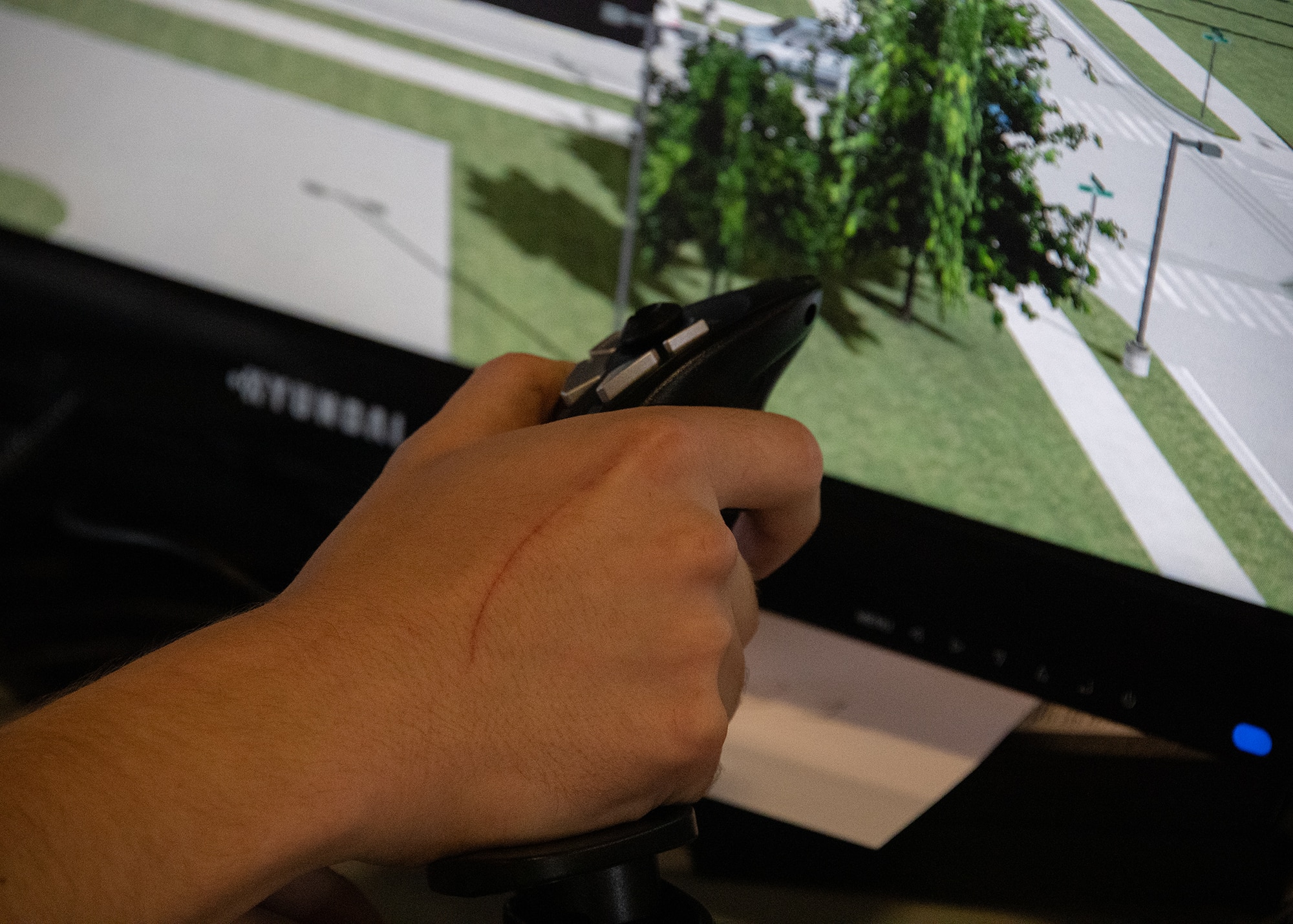 U.S. Air Force Senior Airman Owen Worth, 316th Civil Engineer Squadron firefighter, operates the joystick of the Advanced Disaster Management Simulator at Joint Base Andrews, Md., Aug. 29, 2023.