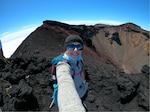 U.S. Navy Lt. Claire Burke reaches the summit of Mount Fuji in Honshu, Japan, the tallest mountain in the country, and one of the highest peaks in the world with an elevation of 3,776 feet.