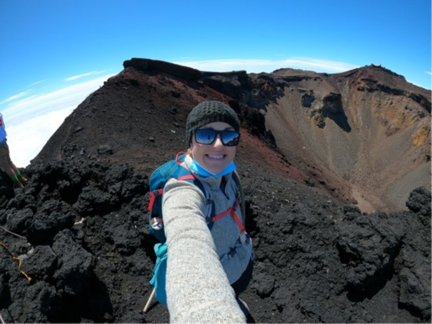 U.S. Navy Lt. Claire Burke reaches the summit of Mount Fuji in Honshu, Japan, the tallest mountain in the country, and one of the highest peaks in the world with an elevation of 3,776 feet.