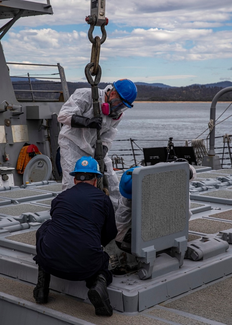 PORT EDEN (Aug. 22, 2023) Sailors aboard the Arleigh Burke-class guided-missile destroyer USS Rafael Peralta (DDG 115) prepare to remove a used SM-2 missile cartridge out of a vertical launching system (VLS) tube during an SM-2 missile reload, Aug. 22. Rafael Peralta is assigned to Task Force 71/Destroyer Squadron (DESRON) 15, the Navy’s largest forward-deployed DESRON and the U.S. 7th Fleet’s principal surface force. (U.S. Navy photo by Mass Communication Specialist 2nd Class Colby A. Mothershead)