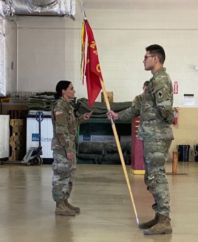 Army Capt. Graciela Arias Tharp, commander of Charlie Battery of the 2nd Battalion, 138th Field Artillery, loads a round into the weapon system prior to firing it downrange during their annual training.