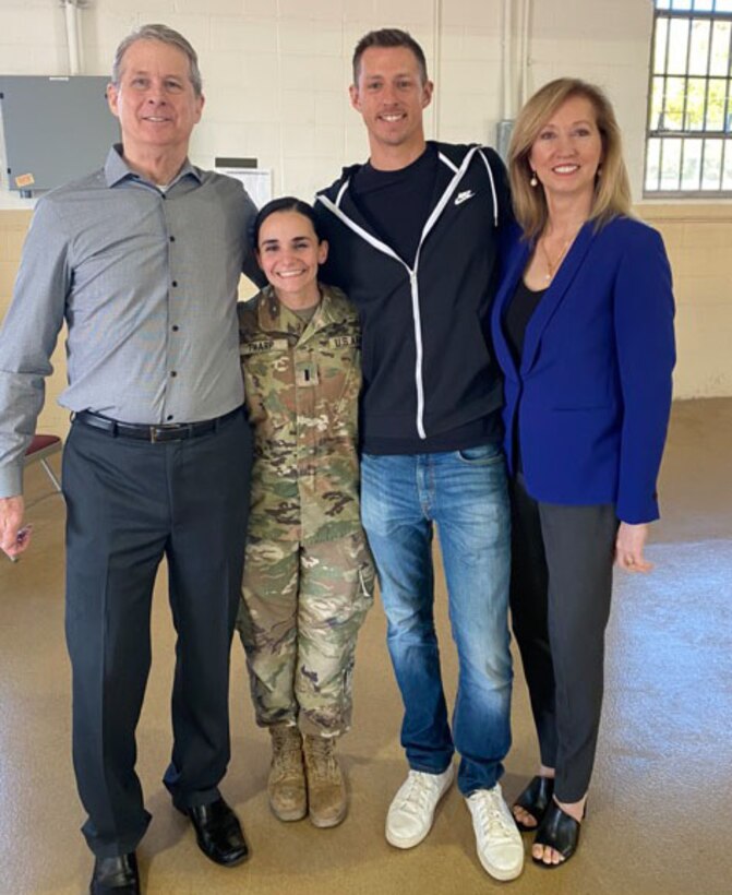 Capt. Graciela Tharp poses with her husband and her in-laws, who attended her change of command ceremony when she took command of the battery.