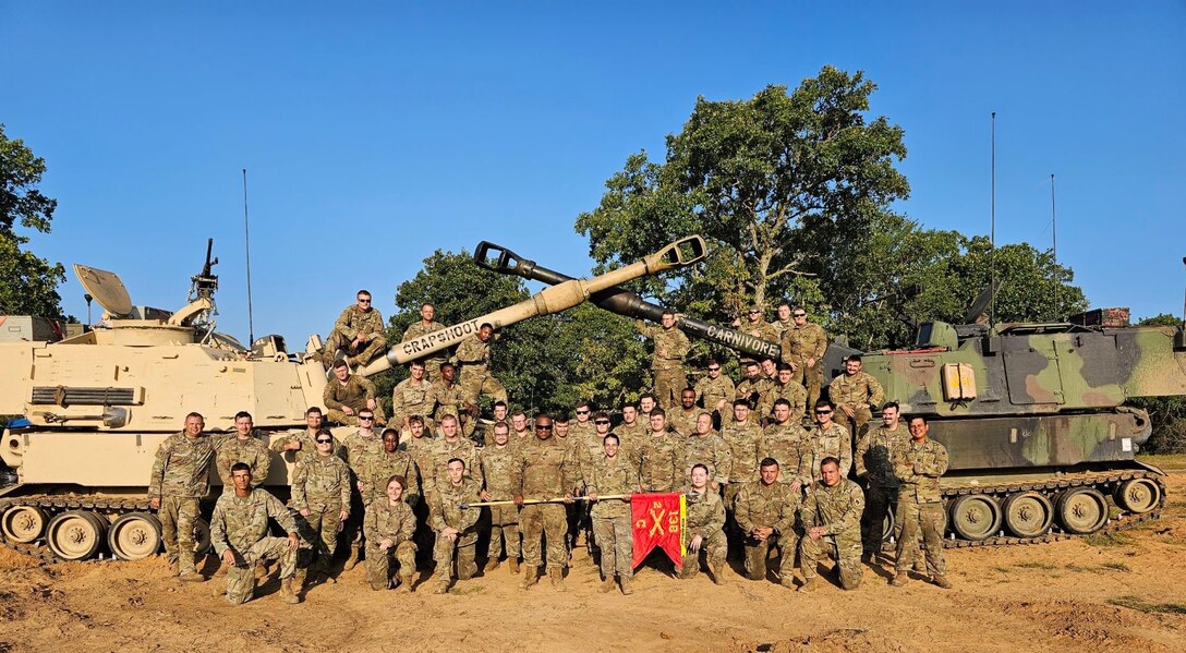 Charlie Battery, 2nd Battalion, 138th Field Artillery poses as a group at Fort Chafffee during their annual training 2023 after winning 'Top Gun'.