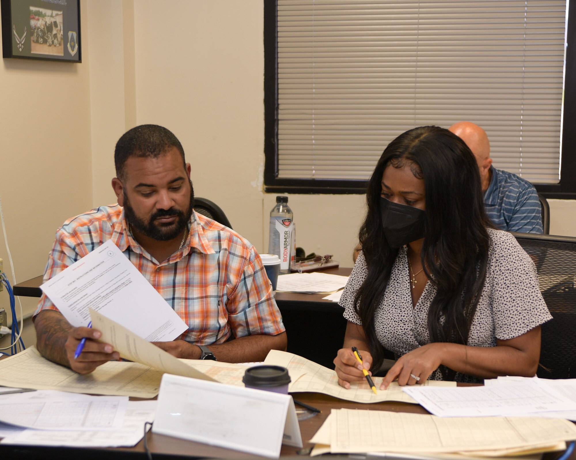 Students of the Allied Ammunition Storage and Transport Publication course collaborate during a course application exercise, August 31, 2023. The week-long training focused on NATO standards for safe ammunition storage. (U.S. Air Force Photo by Ashley Palacios)