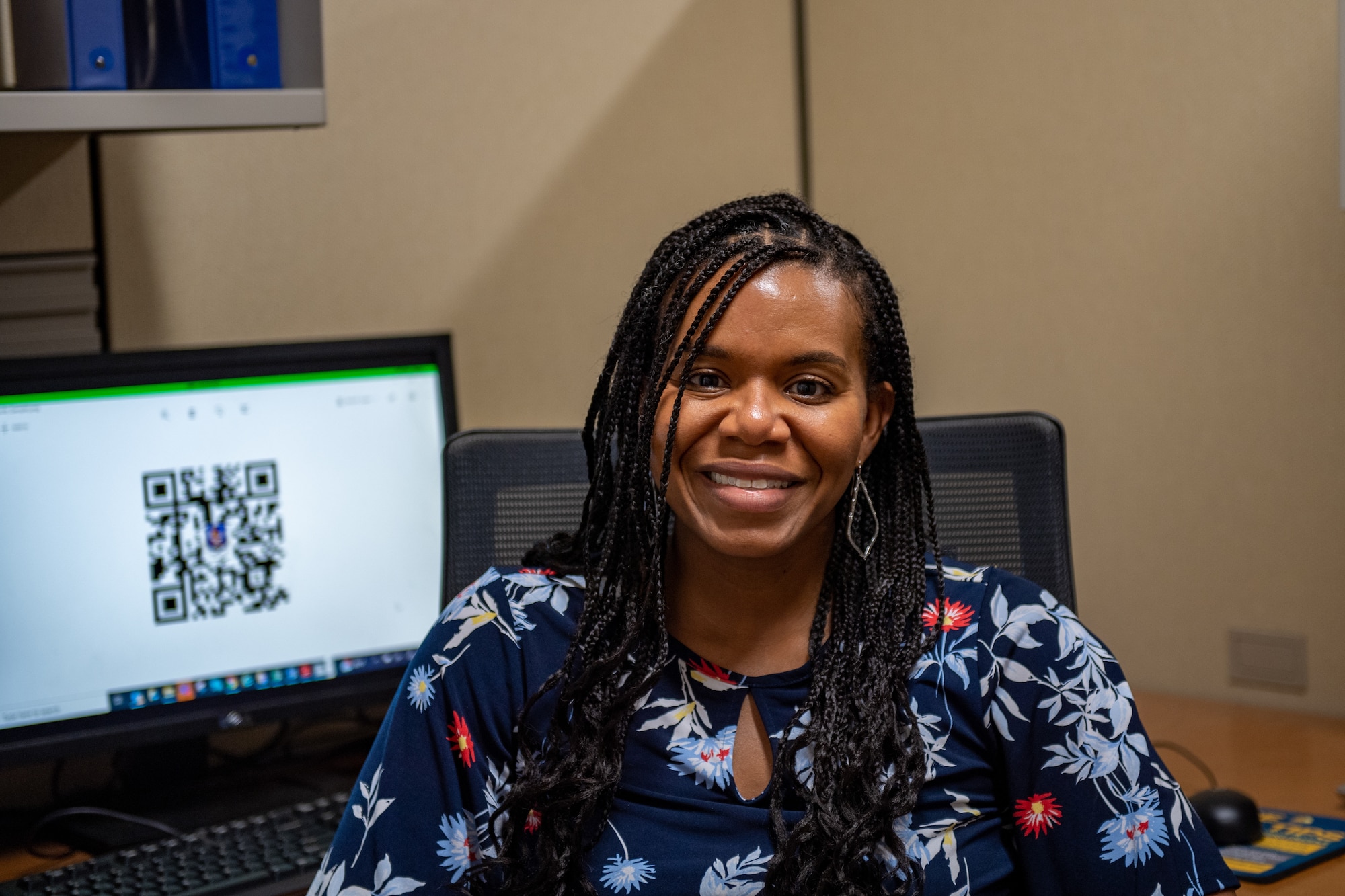 23rd Wing Integrated Prevention Response Director Jacinta Howell smiles for a photo in her office.