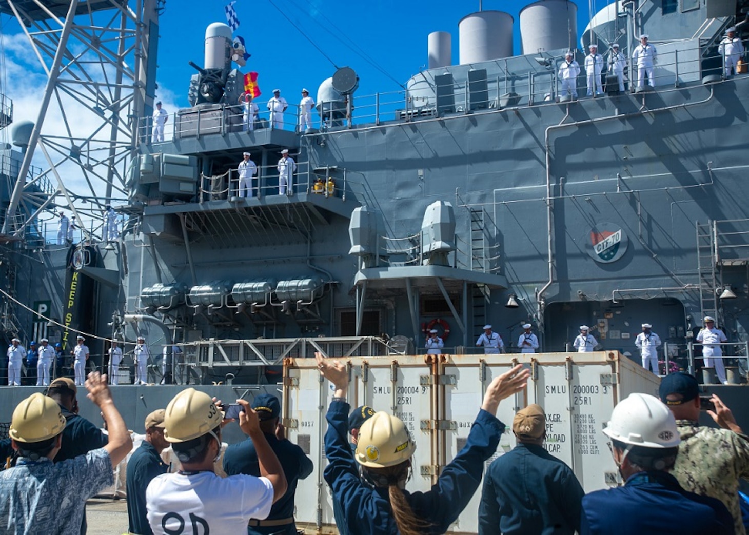 U.S. Navy Sailors and members of Ship Repair Facility (SRF) Yokosuka wave to the Ticonderoga-class guided-missile cruiser USS Shiloh (CG 67) in Yokosuka, Japan, Sept. 5, 2023. Shiloh departed Yokosuka on Sept. 5 to transit to its new homeport of Pearl Harbor, Hawaii, as part of a planned rotation of forces in the Pacific. Shiloh is attached to Commander, Carrier Strike Group 5 forward-deployed to the U.S. 7th Fleet area of operations in support of a free and open Indo Pacific. (U.S. Navy photo by Mass Communication Specialist 2nd Class Askia Collins)