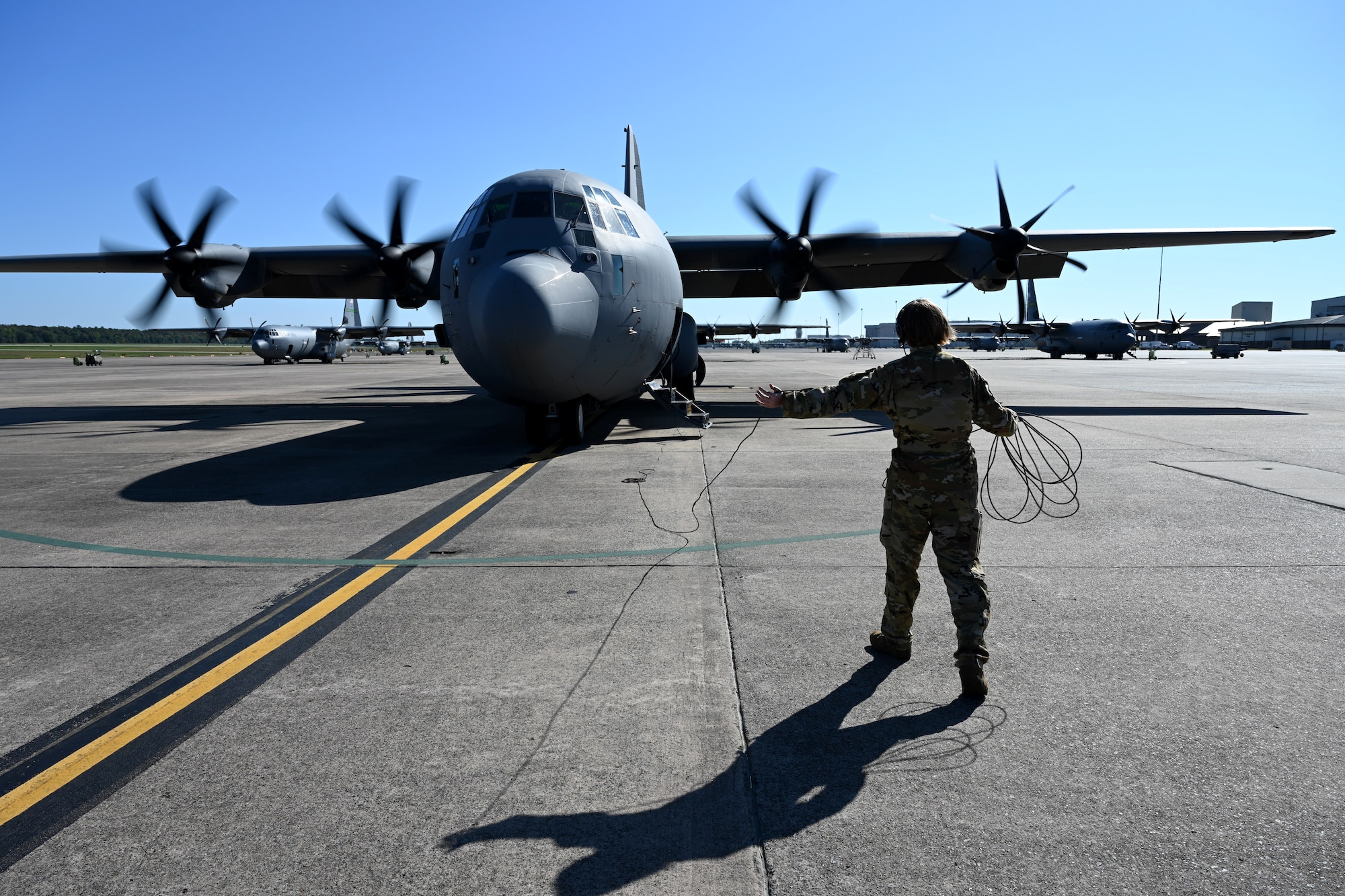 A 19th Airlift Wing loadmaster prepares to board a C-130J Super Hercules before takeoff