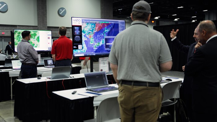 Participants at Modern Day Marine 2023 view MCU's cutting-edge wargaming system