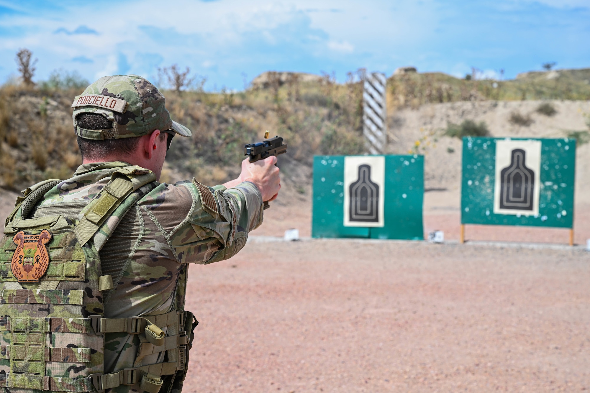 Airman 1st Class Nicholas Porciello, 91st Missile Security Forces Squadron defender, fires an M18 pistol at a target during Operation Frontier Thunder at Camp Guernsey, Wyoming, Aug. 28, 2023. Security Forces personnel regularly conduct weapons training to maintain mission readiness. (U.S. Air Force photo by Airman 1st Class Kyle Wilson)