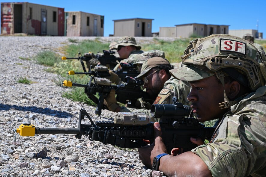 Defenders assigned to the 91st Missile Security Forces Squadron (MSFS) lay prone while providing perimeter security during Operation Frontier Thunder at Camp Guernsey, Wyoming, Aug. 30, 2023. As part of Operation Frontier Thunder, defenders from the 91st MSFS had to assault and secure a simulated hostile outpost. (U.S. Air Force photo by Airman 1st Class Kyle Wilson)