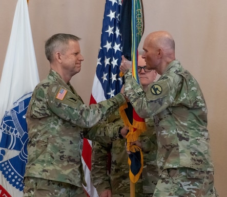 Maj. Gen. Edward Merrigan, Commanding General of the 84th Training Command, passes the guidon to Brig. Gen. Michael J. Dougherty, assuming Command of the 86th Training Division.