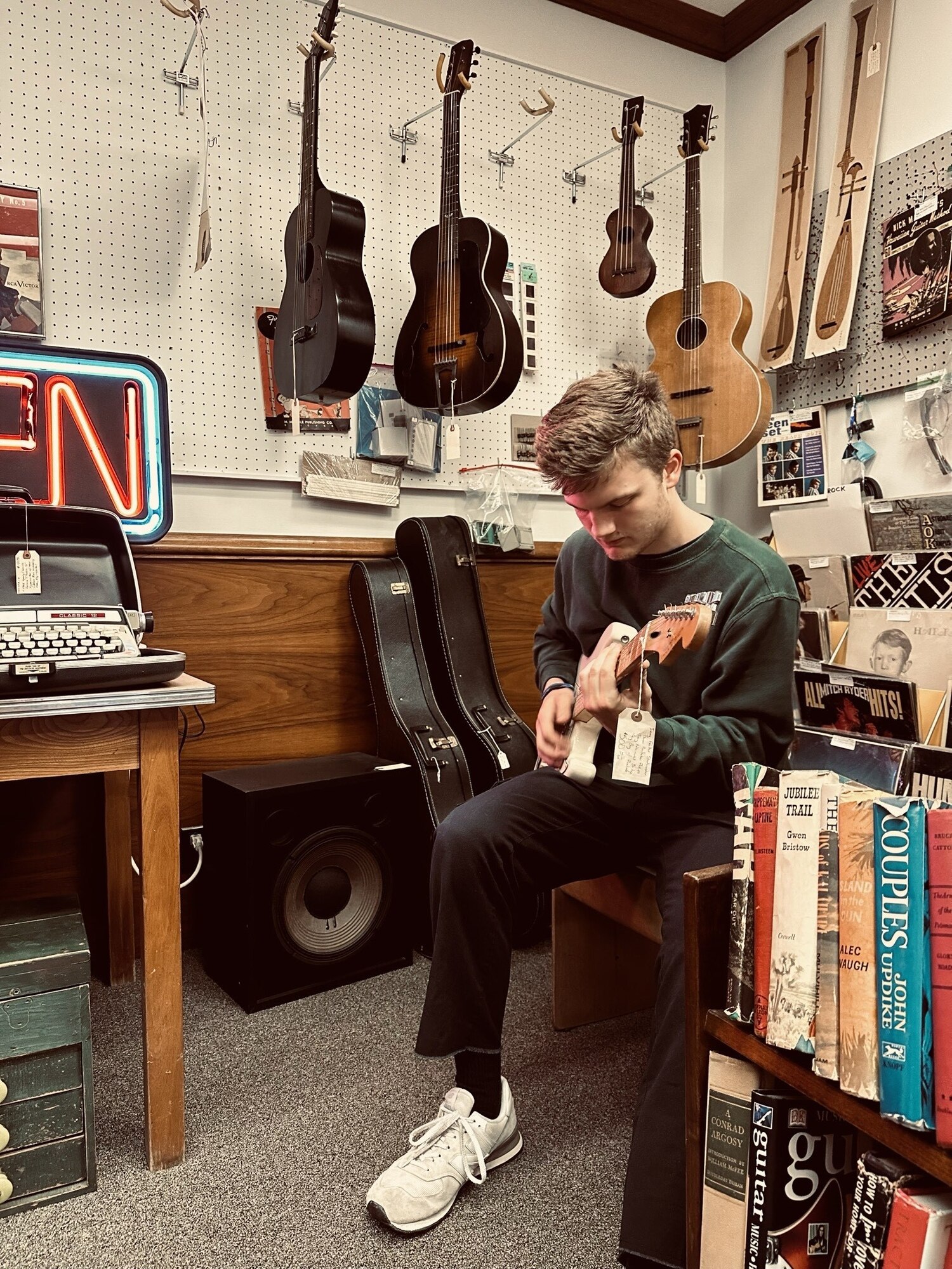 Image of Senior Airman Luke Gibbs playing guitar.