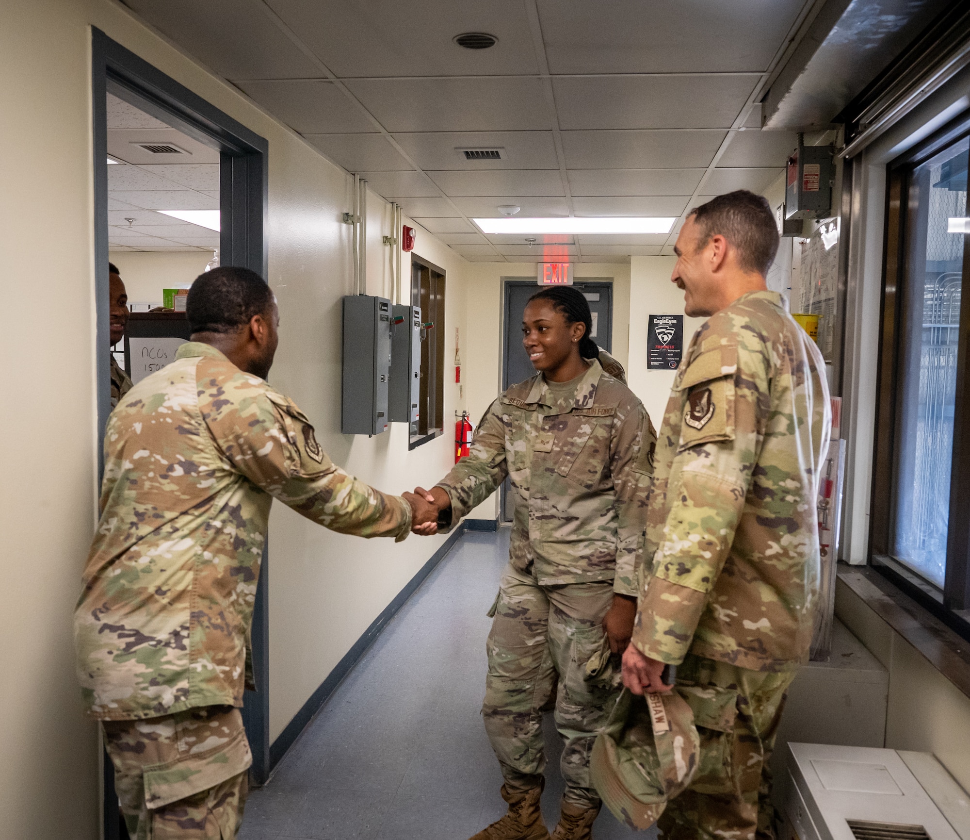 U.S. Air Force Capt. Mark Bradshaw, 51st Fighter Wing chaplain, and Senior Airman Jasmine Blount, 51st FW religious affairs Airman, greet members from the 51st Civil Engineer Squadron during a unit engagement event at Osan Air Base, Republic of Korea, Sept. 6, 2023.