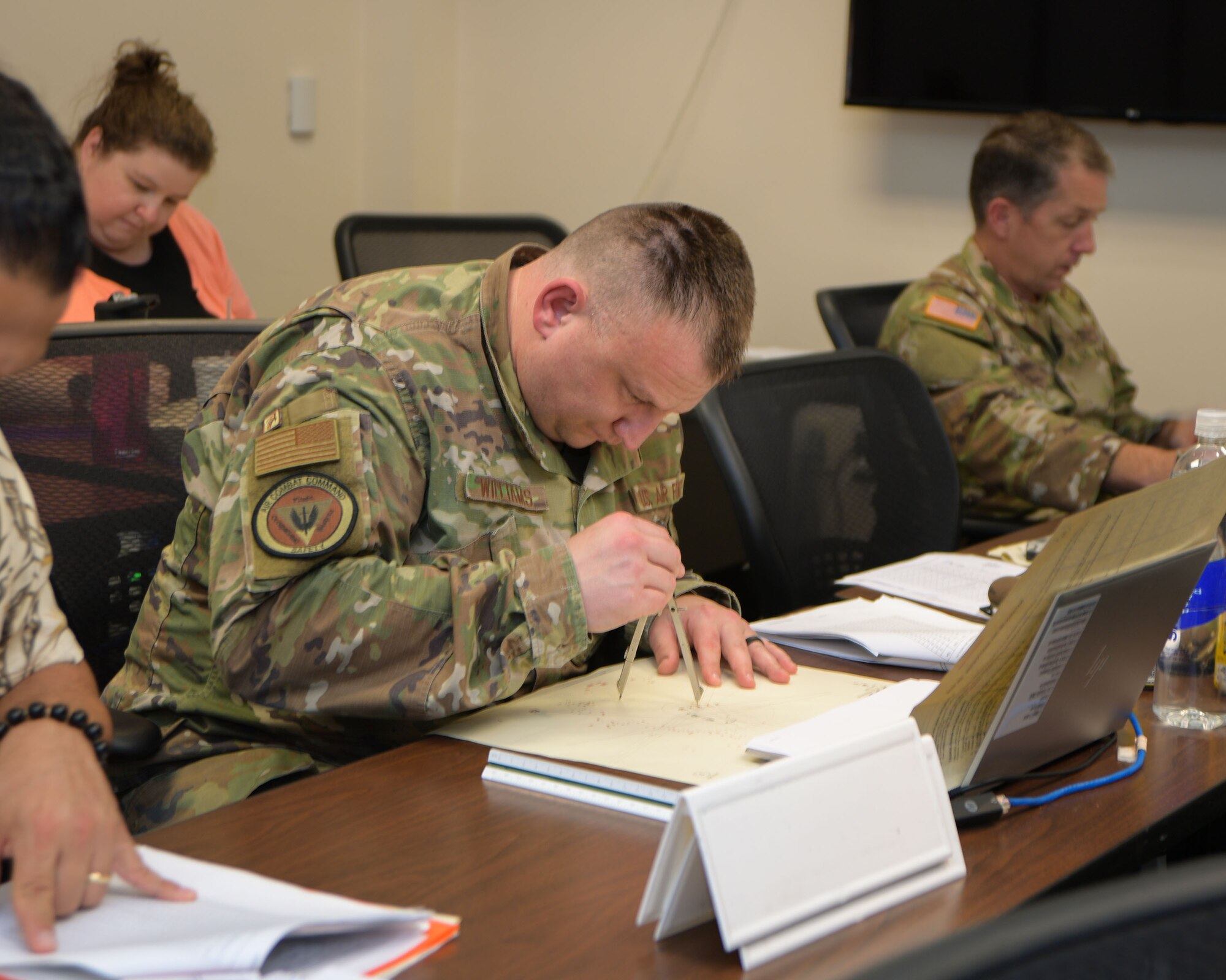 A student of the Allied Ammunition Storage and Transport Publication course works on a course application exercise, August 31, 2023. The week-long training focused on NATO standards for safe ammunition storage. (U.S. Air Force Photo by Ashley Palacios)