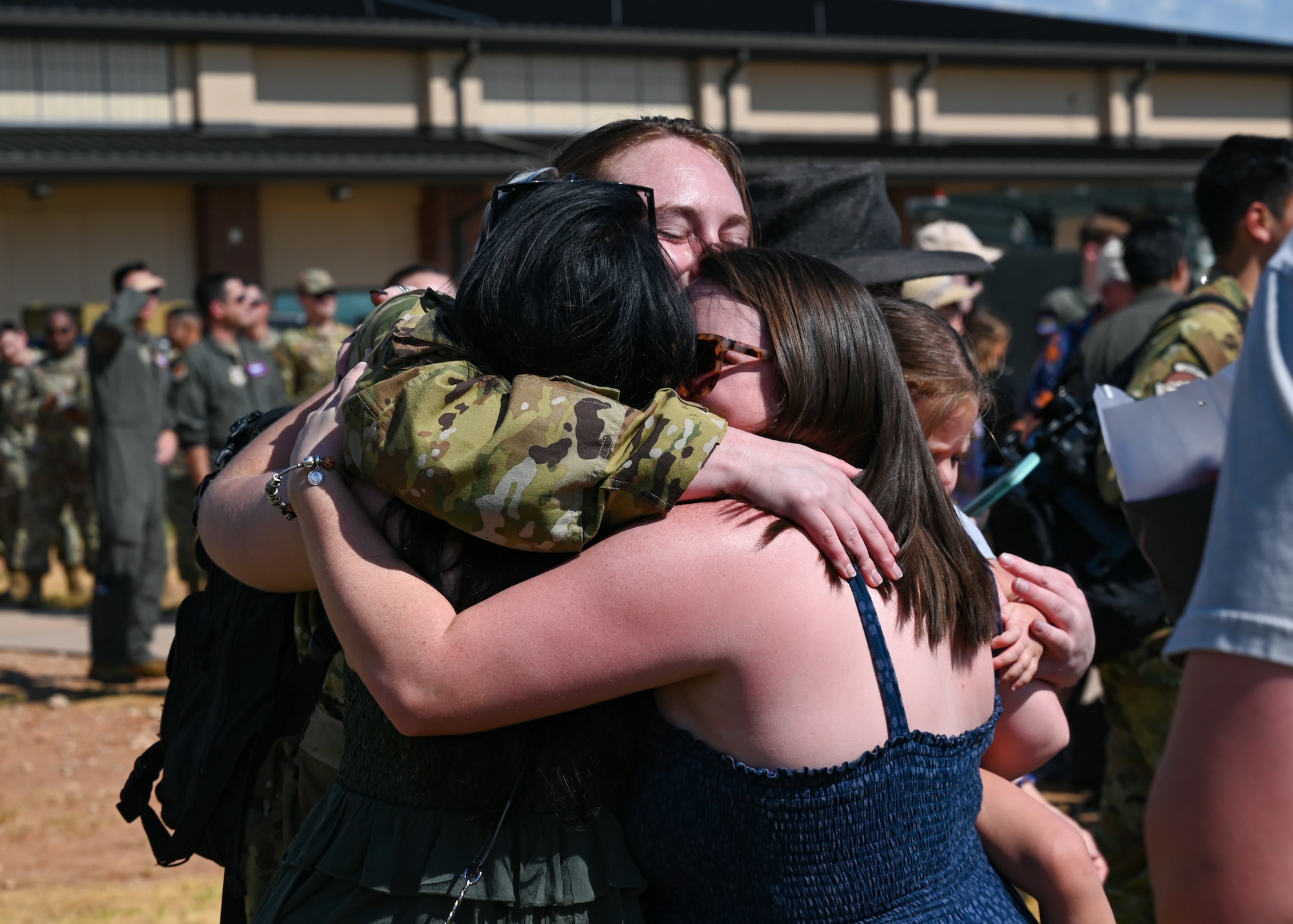 An Airman from the 317th Airlift Wing embraces loved ones.