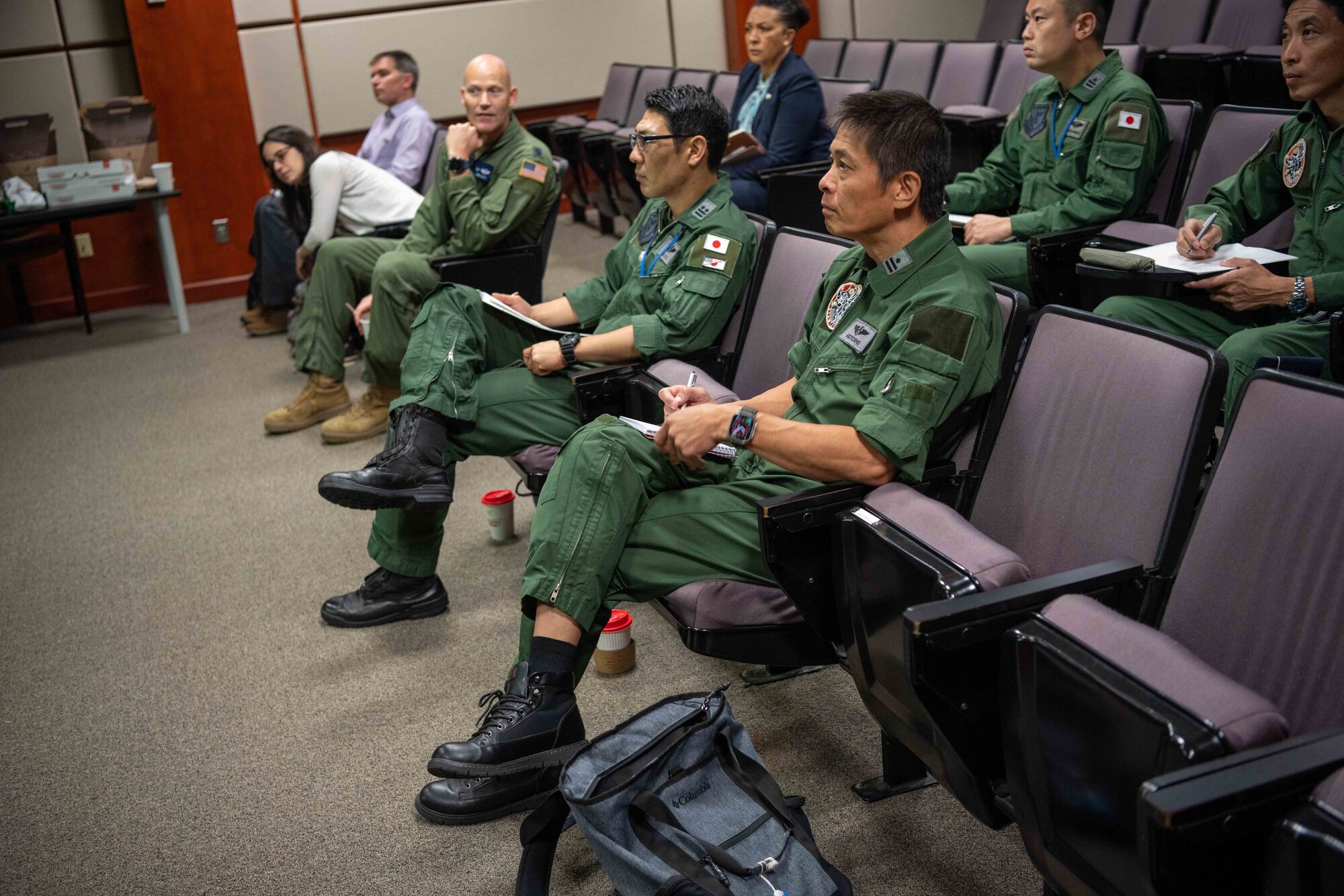 Members from the 405th Air Refueling Squadron, Japan Air Self-Defense, discuss KC-46A Pegasus operations Aug. 29, 2023, at McConnell Air Force Base, Kansas. McConnell Airmen informed the JSDAF members how to effectively operate the KC-46 during their three-day tour of the base. (U.S. Air Force photo by Airman 1st Class William Lunn)