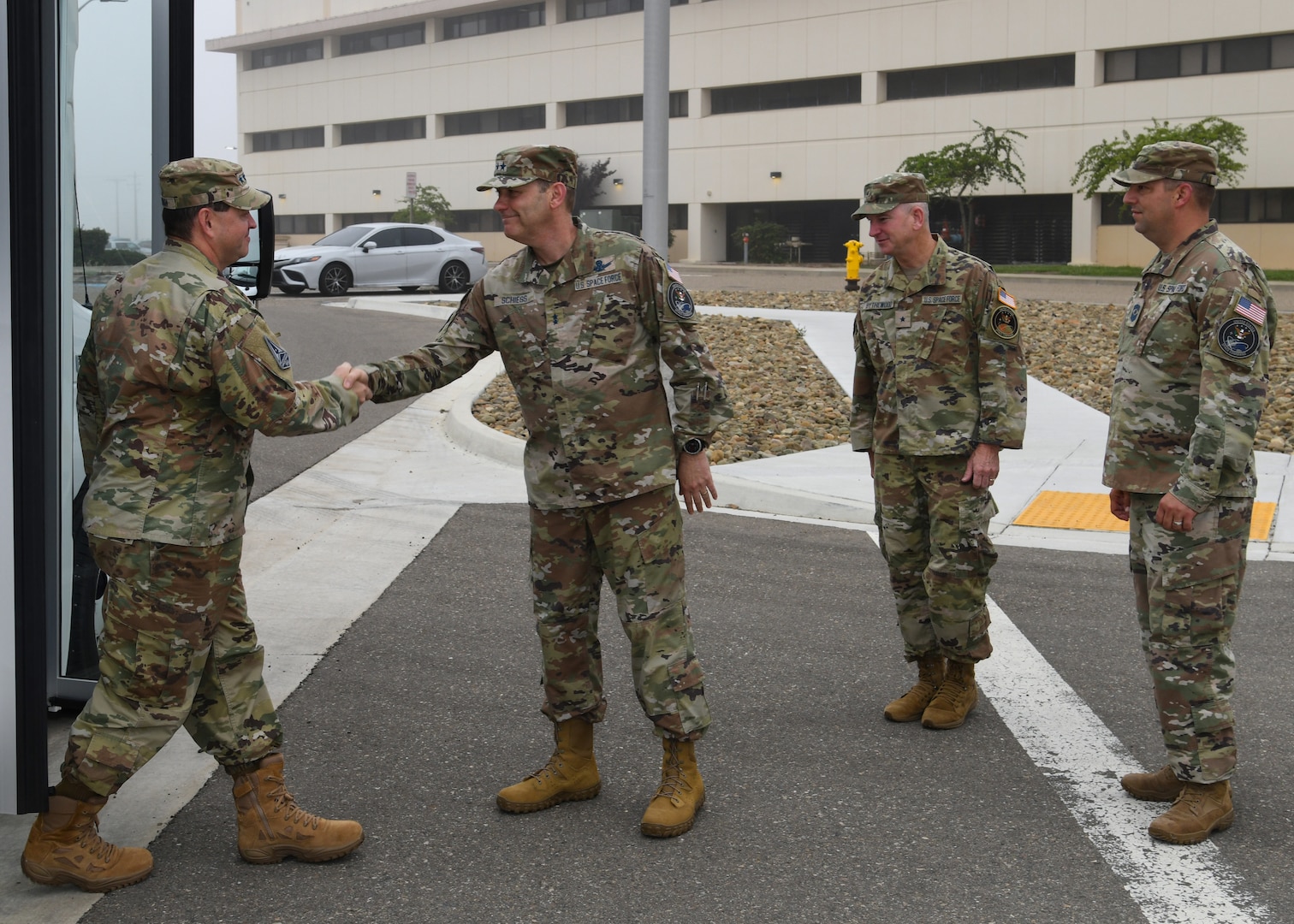 U.S. Space Force Chief of Space Operations Gen. Chance Saltzman, is greeted by U.S. Space Force Maj. Gen. Douglas A. Schiess, Combined Force Space Component Command commander, U.S. Space Force Brig. Gen. Dennis O. Bythewood, Combined Force Space Component Command deputy commander, and U.S. Space Force Chief Master Sgt. Grange S. Coffin, CFSCC senior enlisted leader, during a visit to Vandenberg Space Force Base, California on Aug. 23, 2023.