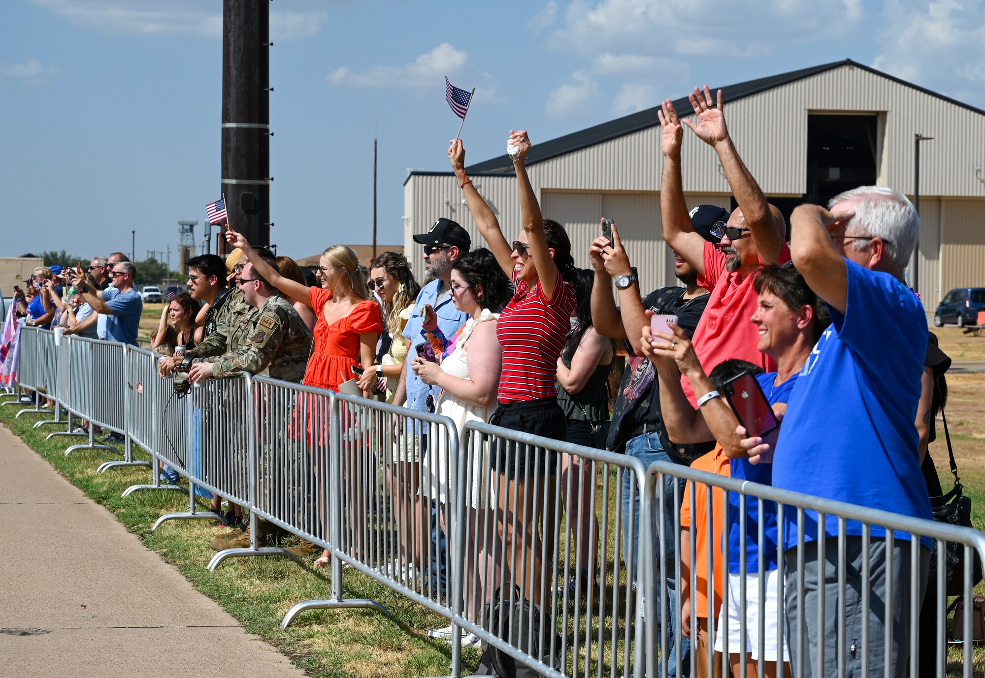 Families and friends of Airmen assigned to the 317th Airlift Wing wave.