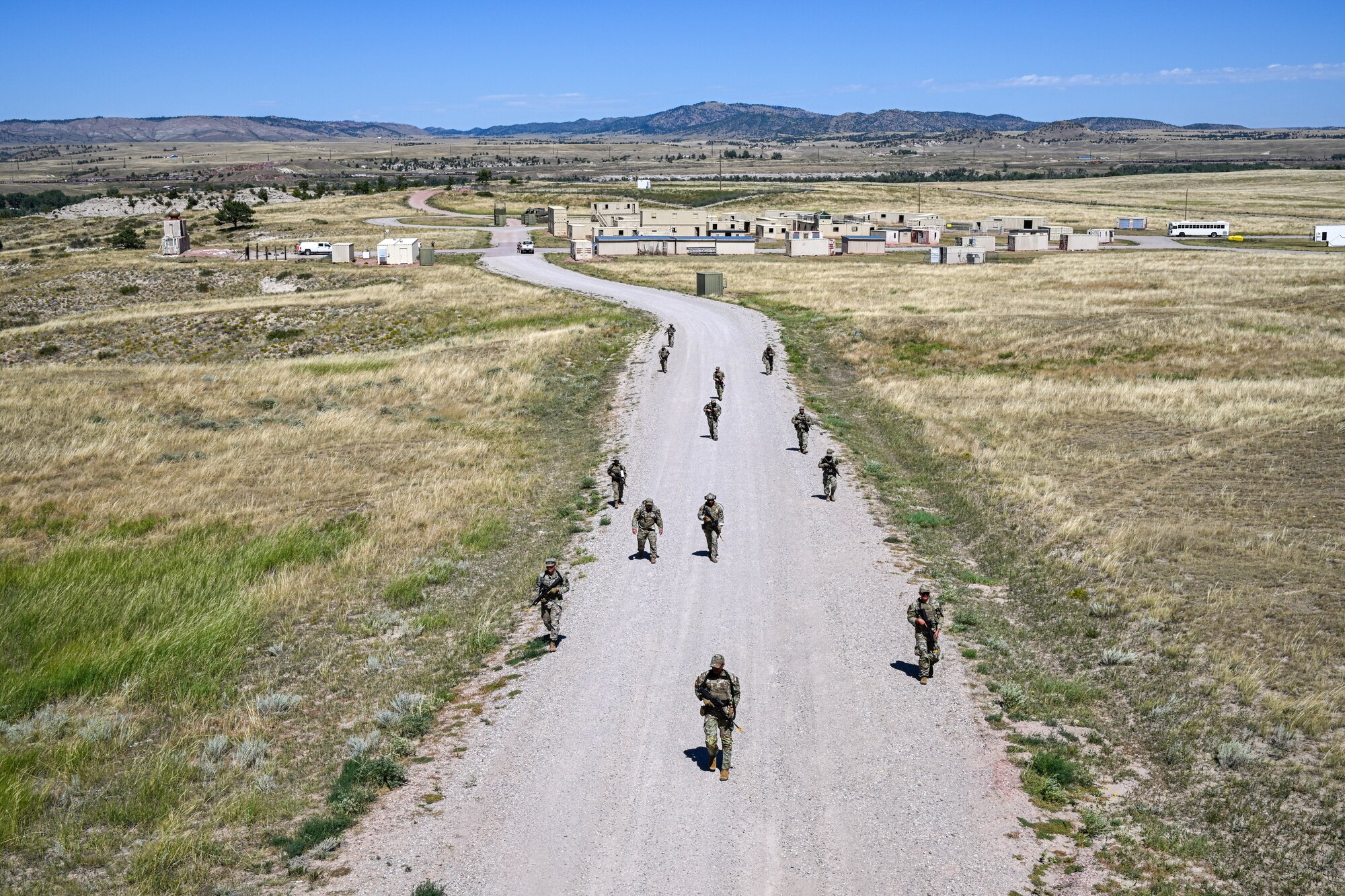 Defenders assigned to the 91st Missile Security Forces Squadron (MSFS) ruck up a hill during Operation Frontier Thunder at Camp Guernsey, Wyoming, Aug. 30, 2023. Operation Frontier Thunder was a deployment readiness exercise designed to test 91st MSFS defender’s expeditionary skills. (U.S. Air Force photo by Airman 1st Class Kyle Wilson)