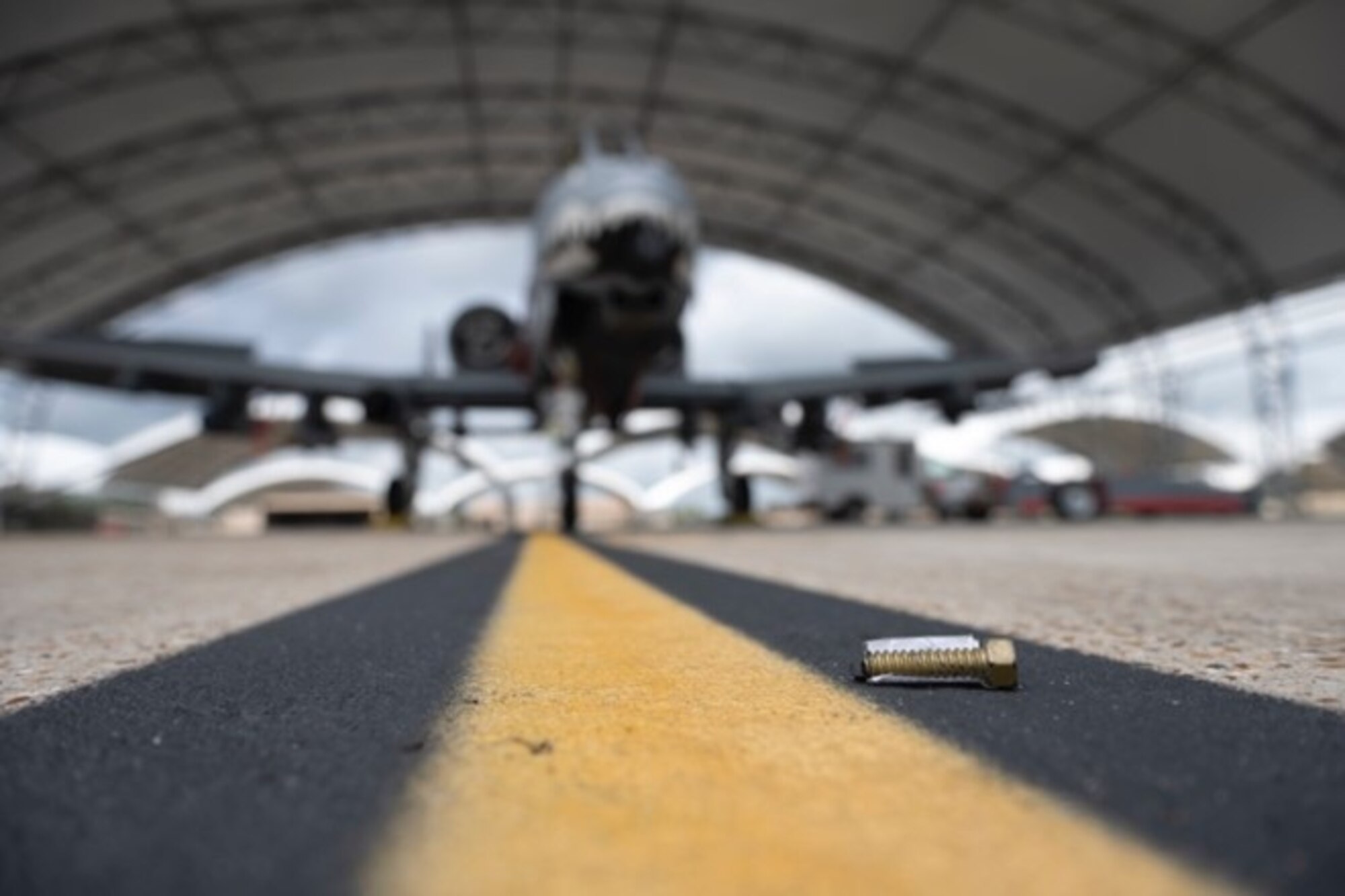 A golden bolt sits on the flightline