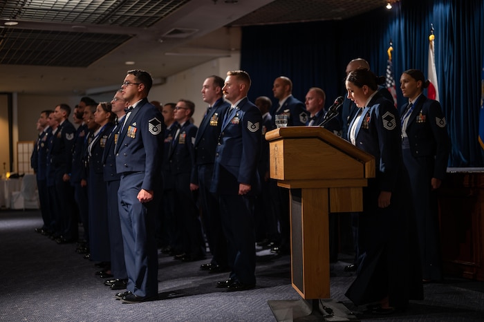 Current and soon-to-be Senior NCO’s stand at attention while reciting the SNCO creed during a SNCO Induction Ceremony.