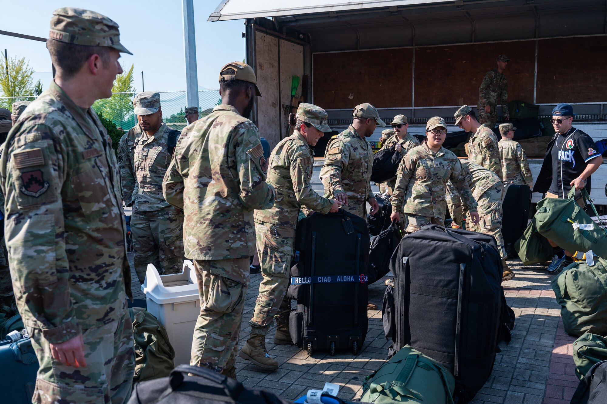 8th Fighter Wing members unload cargo in support of returning members from Operation Pack Up.