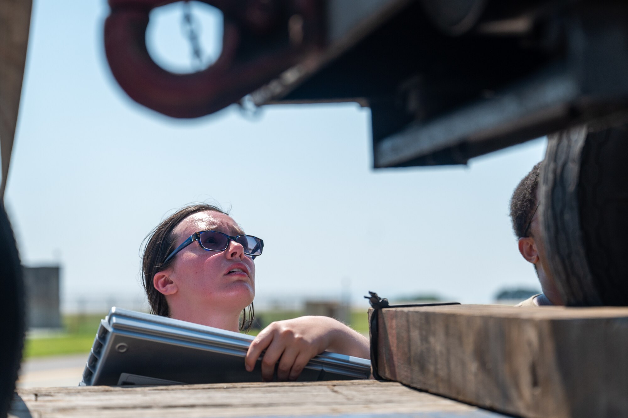 Airman 1st Class Kylee Motyka inspects cargo in transit from the 80th and 35th Fighting Squadrons following Operation Pack Up.