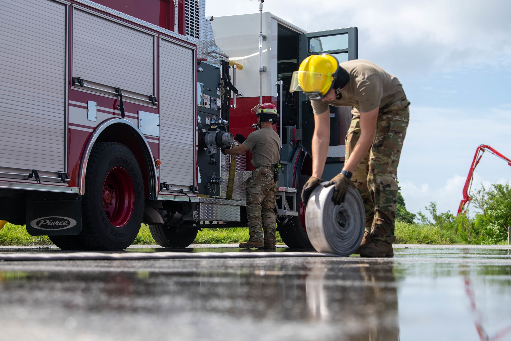 18th CES Firemen conduct a clean up after a structure fire exercise