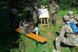 A member of the Association of Reservists of the German Armed Forces, Dülmen provides instruction to Capt. Roberto Rivera, Dülmen Army Prepositioned Stocks-2 worksite plans and operations officer, and Sgt. 1st Class Belloc Anim, the site’s senior supply noncommissioned officer, during the reserve unit’s annual comradeship bivouac, Aug. 26. (Courtesy photo)
