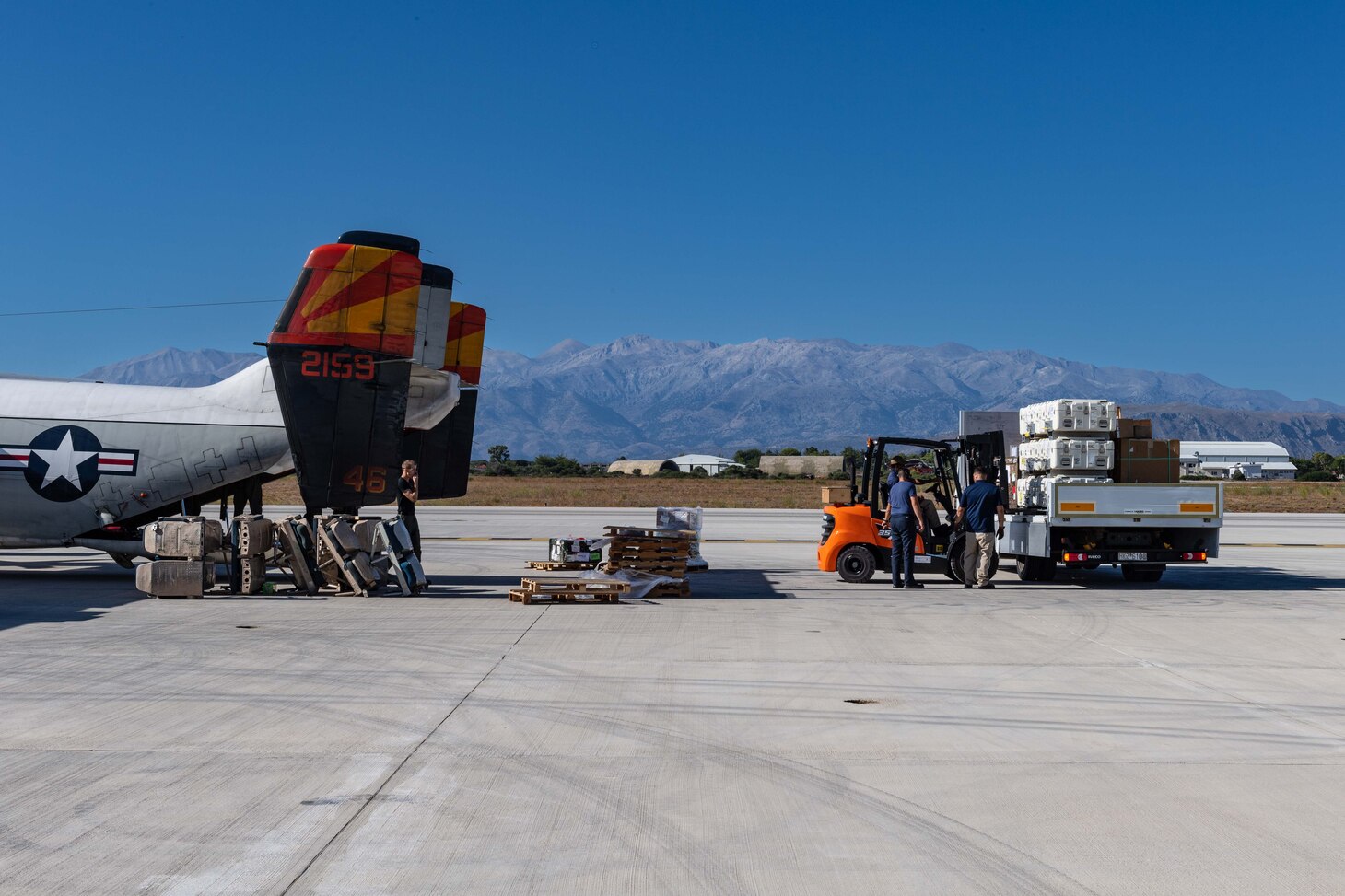 A remotely-located logistics detachment of USS Gerald R. Ford (CVN 78), with the support of Naval Support Activity Souda Bay’s Air Cargo Services department and Naval Supply Systems Command Fleet Logistics Center Sigonella, Site Souda Bay, loads cargo destined for the ship aboard a C-2A Greyhound assigned to Detachment Two of the Fleet Logistics Support Squadron 40, Aug. 31, 2023.