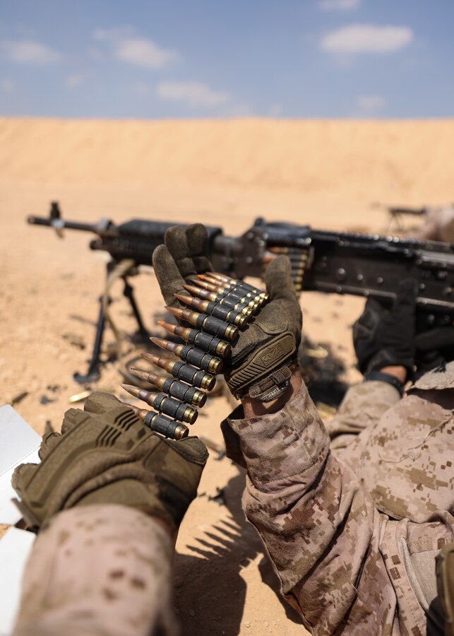 A U.S. Marine with 4th Assault Amphibian Battalion, U.S. Marine Corps Reserves, loads the M240B machine gun at a range during exercise Bright Star 23 at Mohamed Naguib Military Base, Egypt, Sept. 5, 2023. Bright Star 23 is a multilateral U.S. Central Command exercise held with the Arab Republic of Egypt across air, land, and sea domains that promotes and enhances regional security and cooperation, and improves interoperability in irregular warfare against hybrid threat scenarios. (U.S. Marine Corps photo by Sgt. Angela Wilcox)