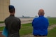 U.S. Air Force Capt. Levi Hilgenhold, 23rd Bomb Squadron B-52H Stratofortress pilot, and the Honorable Tom Ross, mayor of Minot, North Dakota, observe a B-52H Stratofortress taking off at Minot Air Force Base, North Dakota, Sept. 5, 2023. Mayor Ross was invited for an incentive flight and completed several ground training courses prior to his flight. (U.S. Air Force photo by Senior Airman Zachary Wright)